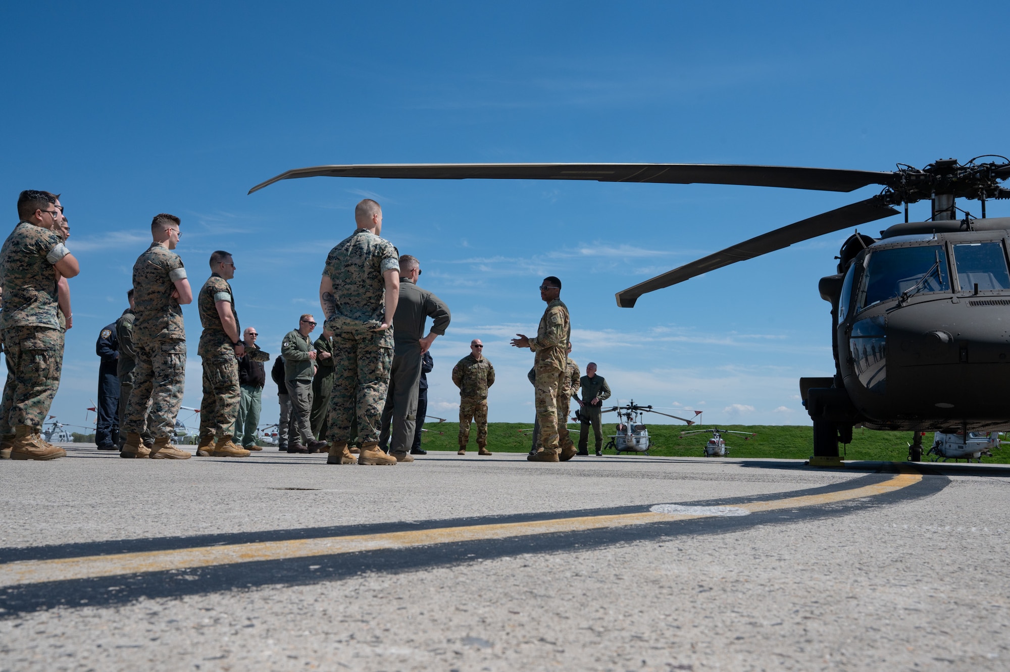U.S. Army Maj. Andre Stevenson, New Jersey National Guard Aviation Army Support Facility deputy state aviation officer and UH-60M Black Hawk helicopter instructor pilot, shares the Black Hawk’s capabilities with joint and mission partners during the Mid-Atlantic Aviation Coordination Summit at Joint Base McGuire Dix-Lakehurst, N.J., May 1, 2026. Local first responders and mission partners shared their unit’s capabilities to ensure smooth future coordination should a large-scale disaster occur. (U.S. Air Force photo by Airman 1st Class Haeleigh Bayle)
