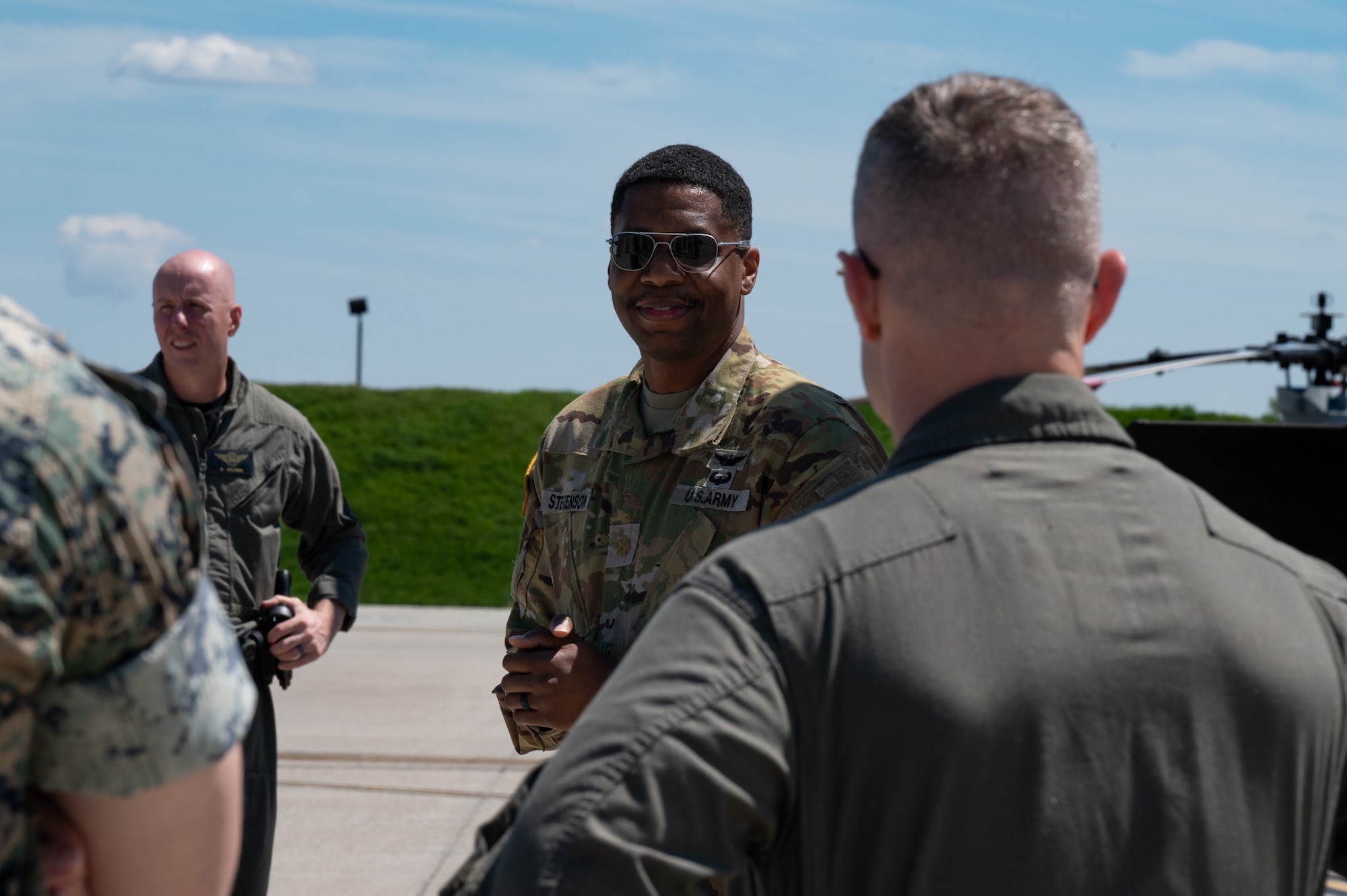 U.S. Army Maj. Andre Stevenson, New Jersey National Guard Aviation Army Support Facility deputy state aviation officer and UH-60M Black Hawk helicopter instructor pilot, explains the Black Hawk’s capabilities to joint and mission partners during the Mid-Atlantic Aviation Coordination Summit at Joint Base McGuire-Dix-Lakehurst, N.J., May 1, 2026. Stevenson and other attendees shared their unit’s functions and capabilities to ensure interoperability success during large-scale disasters. (U.S. Air Force photo by Airman 1st Class Haeleigh Bayle)