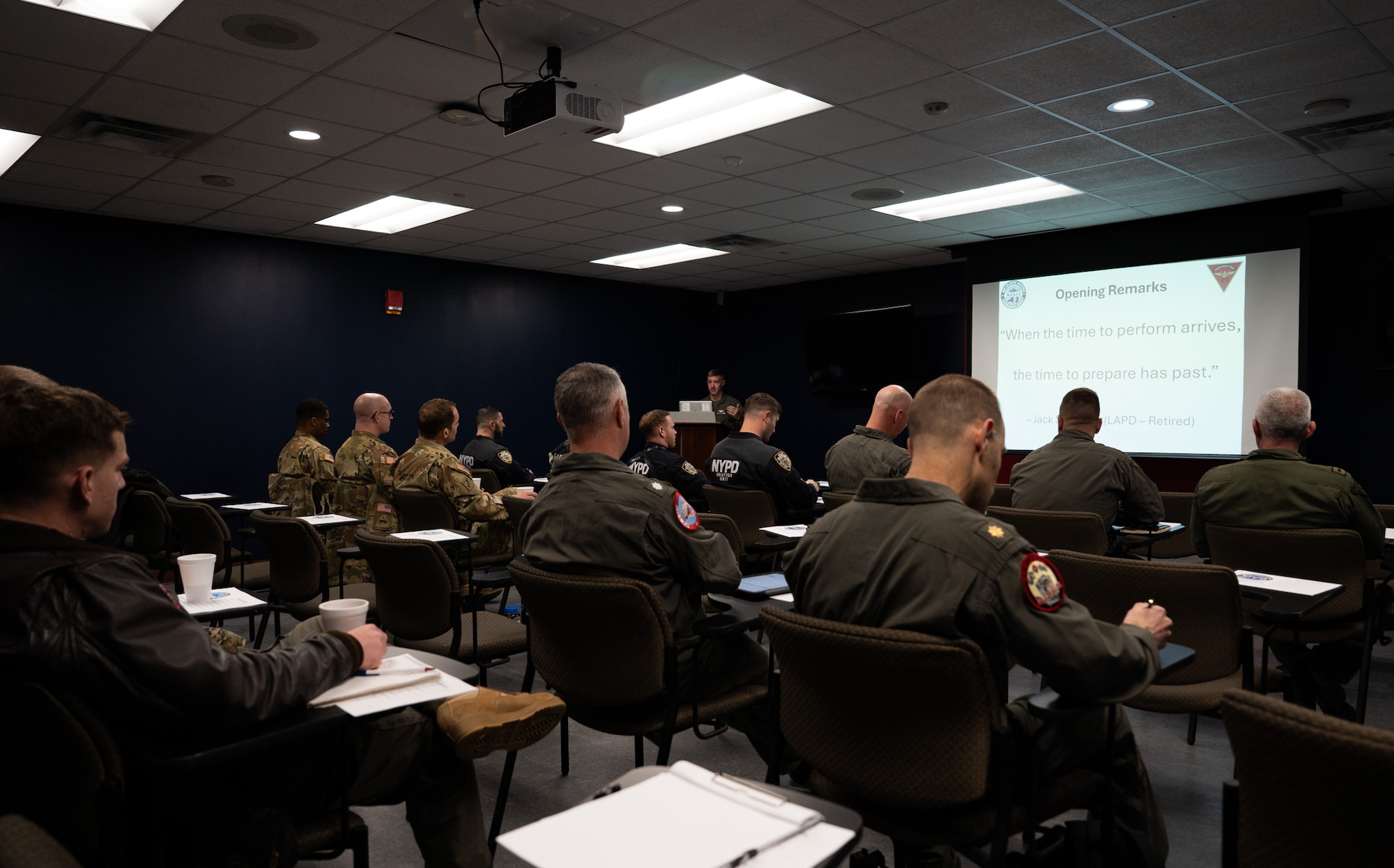 U.S. Marine Corps Lt. Col. Taylor Dodd, Marine Aircraft Group 49 operations officer, briefs Mid-Atlantic Aviation Coordination Summit attendees at Joint Base McGuire-Dix-Lakehurst, N.J., May 1, 2026. The MAACS brought local first responders and mission partners together to coordinate effective disaster response when operating in the same air space. (U.S. Air Force photo by Airman 1st Class Haeleigh Bayle)