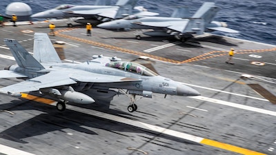 An EA-18 Growler, attached to Electronic Attack Squadron (VAQ) 141, lands on the flight deck of Nimitz-class aircraft carrier USS George Washington (CVN 73) while underway in the Philippines Sea, May 25, 2026.
