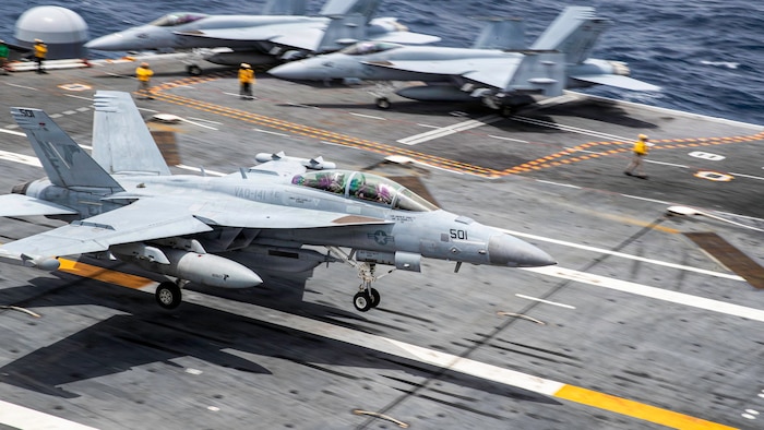 An EA-18 Growler, attached to Electronic Attack Squadron (VAQ) 141, lands on the flight deck of Nimitz-class aircraft carrier USS George Washington (CVN 73) while underway in the Philippines Sea, May 25, 2026.