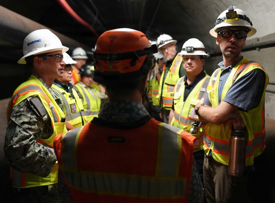 A Navy Closure Task Force-Red Hill (NCTF-RH) contractor maintains a safety boundary while members of the Hawaii Department of Health and the Environmental Protection Agency inspect pipe removal operations at the Red Hill Bulk Fuel Storage Facility (RHBFSF) in Honolulu, May 13, 2026. Charged with the safe decommissioning of the RHBFSF, NCTF-RH was established by the Department of the Navy as a commitment to the community and the environment. NCTF-RH continues to engage with the people of Hawaii, regulatory agencies, and other stakeholders as it safely and deliberately decommissions the facility. (U.S. Navy photo by Mass Communication Specialist 1st Class Glenn Slaughter)