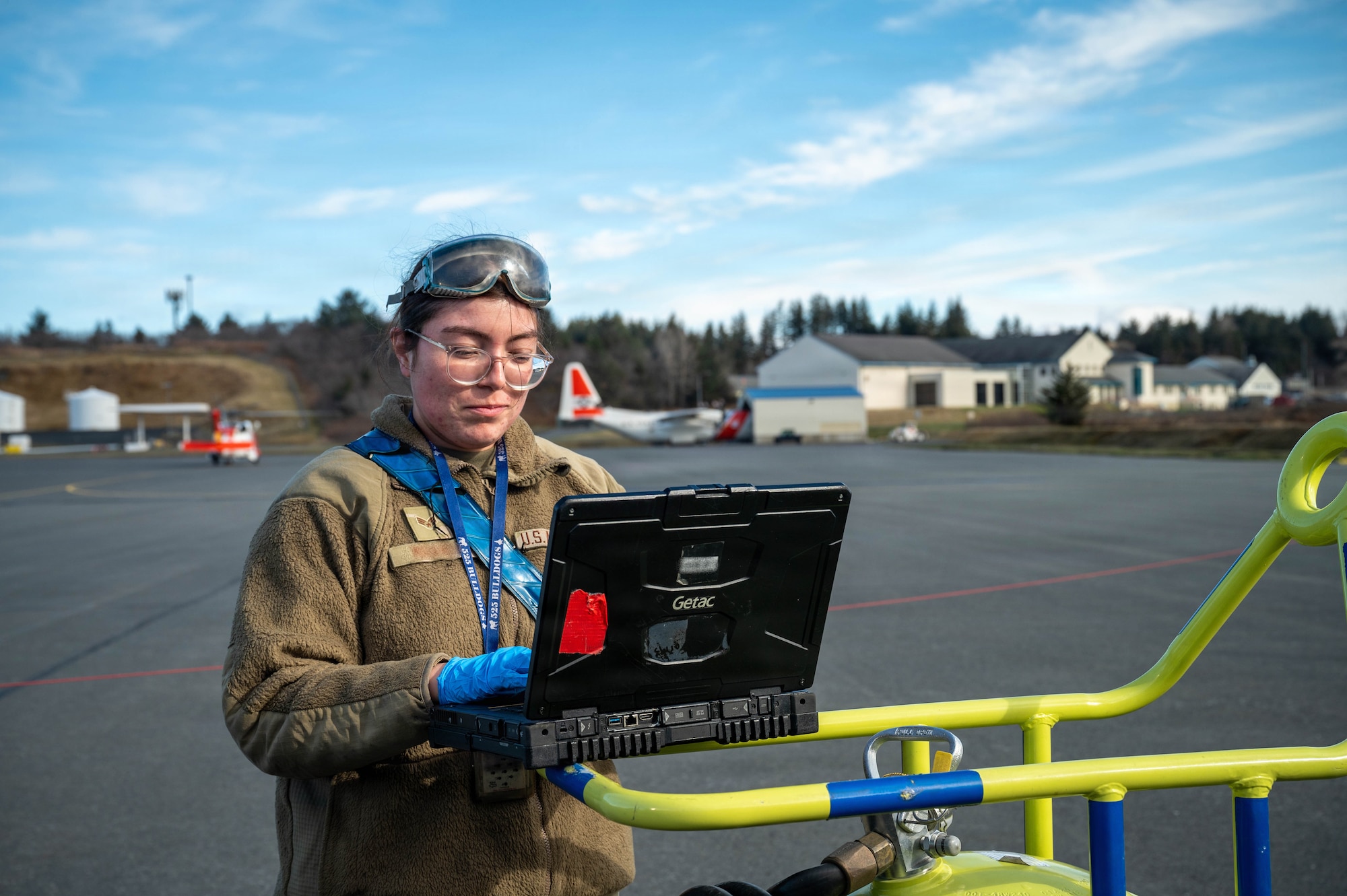 A U.S. Air Force Dedicated Crew Chief assigned to the 3rd Air Expeditionary Wing conducts a post-flight check for an F-22 Raptor aircraft assigned to the 3rd Wing during exercise Tropic Tundra 26 at U.S. Coast Guard Air Station Kodiak, Alaska, May 11, 2026.