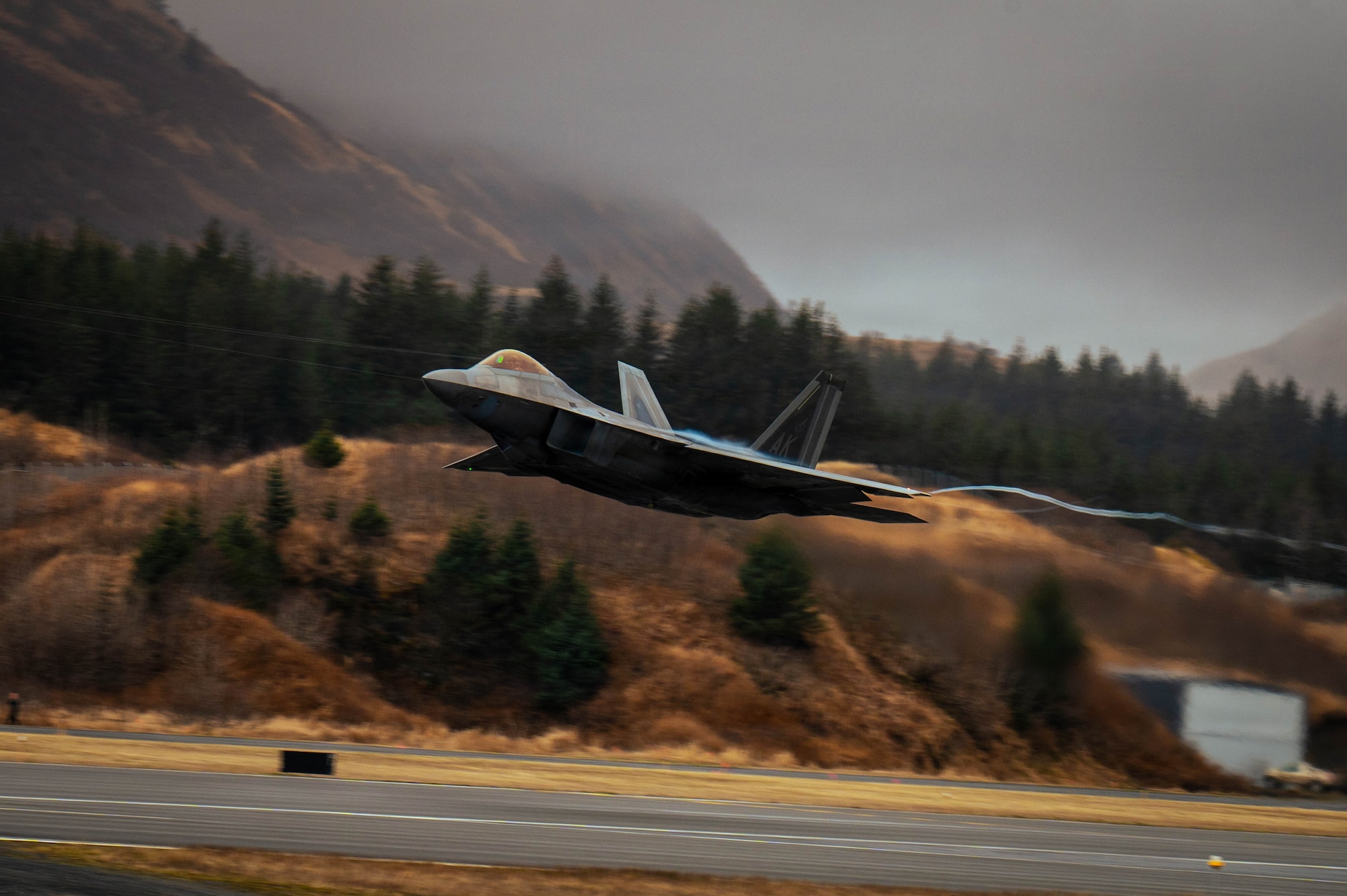 A U.S. Air Force F-22 Raptor aircraft assigned to the 3rd Wing takes off during an Alaskan NORAD Region practice alert response at U.S. Coast Guard Air Station Kodiak, Alaska, May 13, 2026.