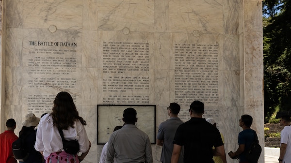 U.S. Marines with Marine Rotational Force – Southeast Asia, I Marine Expeditionary Force, read an inscription detailing the Battle of Bataan during a staff ride in honor of Memorial Day at Mount Samat National Shrine of Valor, Bataan, Philippines, May 23, 2026. MRF-SEA serves as I MEF’s forward command element, supporting Task Force - Philippines and integrating with the Armed Forces of the Philippines to strengthen interoperability and improve combined readiness. (U.S. Marine Corps photo by Cpl. Ryan Ramsammy)