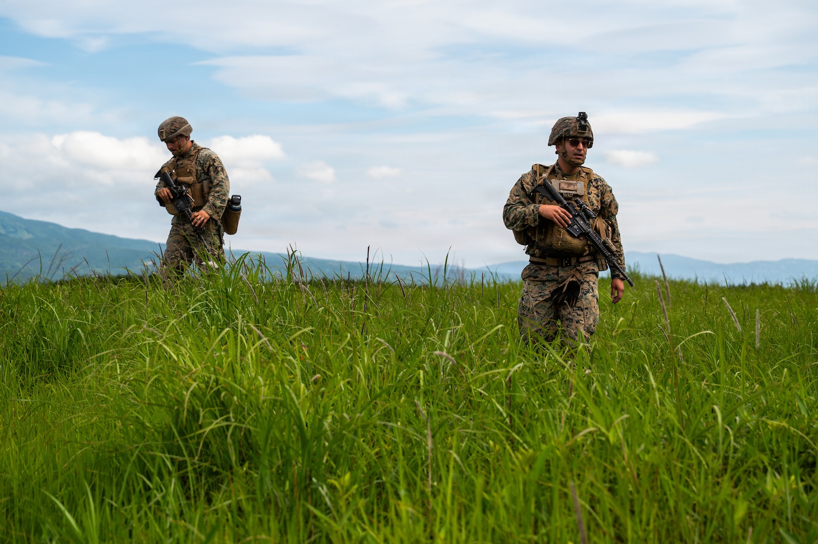 U.S. Marines with the 3rd Battalion, 12th Marine Regiment, 3rd Marine Division scout a location before parking a High Mobility Artillery Rocket System during a demonstration at the East Fuji Maneuver Area, Camp Fuji, Japan, May 20, 2026.