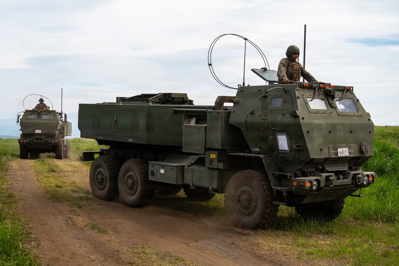 U.S. Marines with the 3rd Battalion, 12th Marine Regiment, 3rd Marine Division drive a High Mobility Artillery Rocket System into position before a training demonstration at the East Fuji Maneuver Area, Camp Fuji, Japan, May 20, 2026.