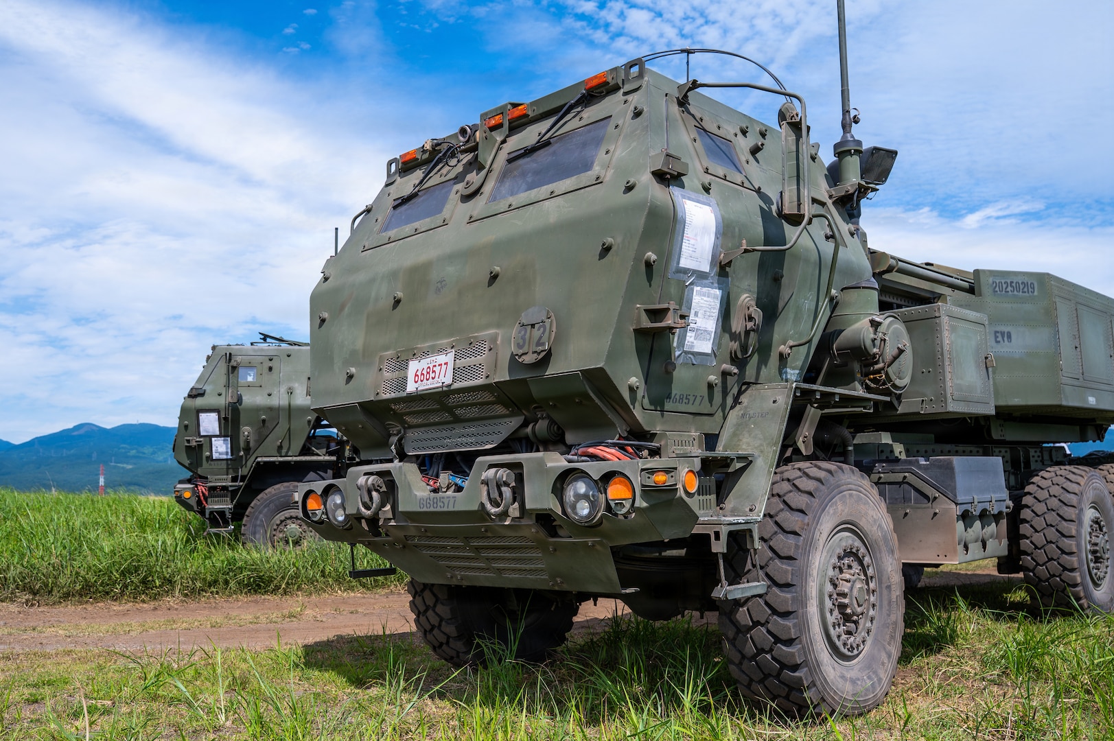 High Mobility Artillery Rocket Systems assigned to the 3rd Battalion, 12th Marine Regiment, 3rd Marine Division are parked during a training demonstration at the East Fuji Maneuver Area, Camp Fuji, Japan, May 20, 2026.