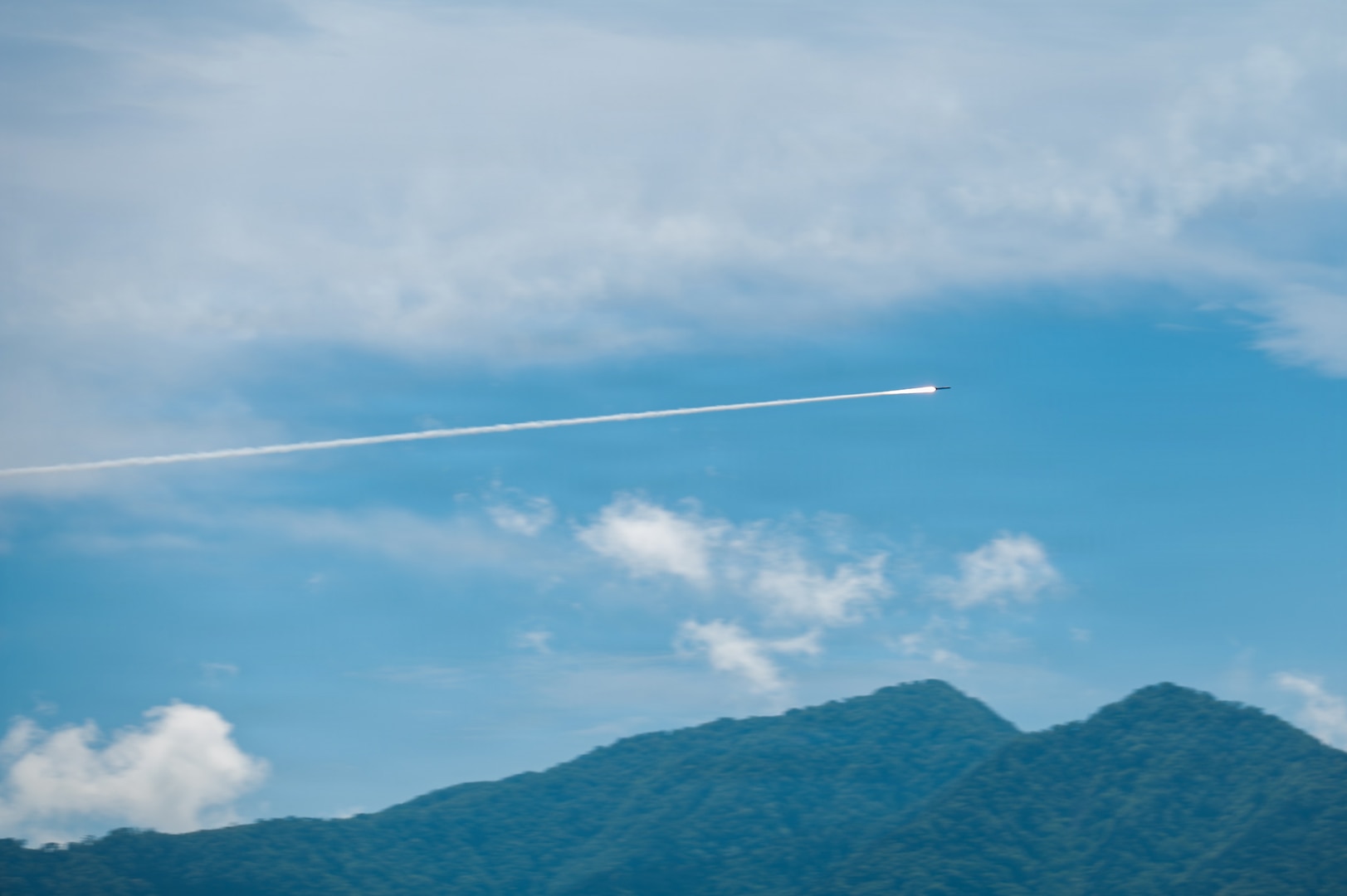 A rocket fired by a High Mobility Artillery Rocket System assigned to the U.S. Marine Corps 3rd Battalion, 12th Marine Regiment, 3rd Marine Division flies during a live-fire training event at the East Fuji Maneuver Area, Camp Fuji, Japan, May 20, 2026.