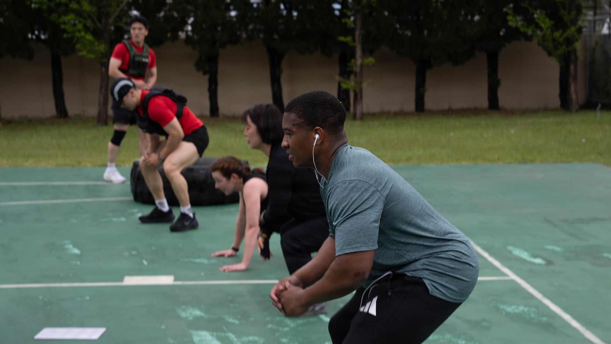 Airmen do squats.