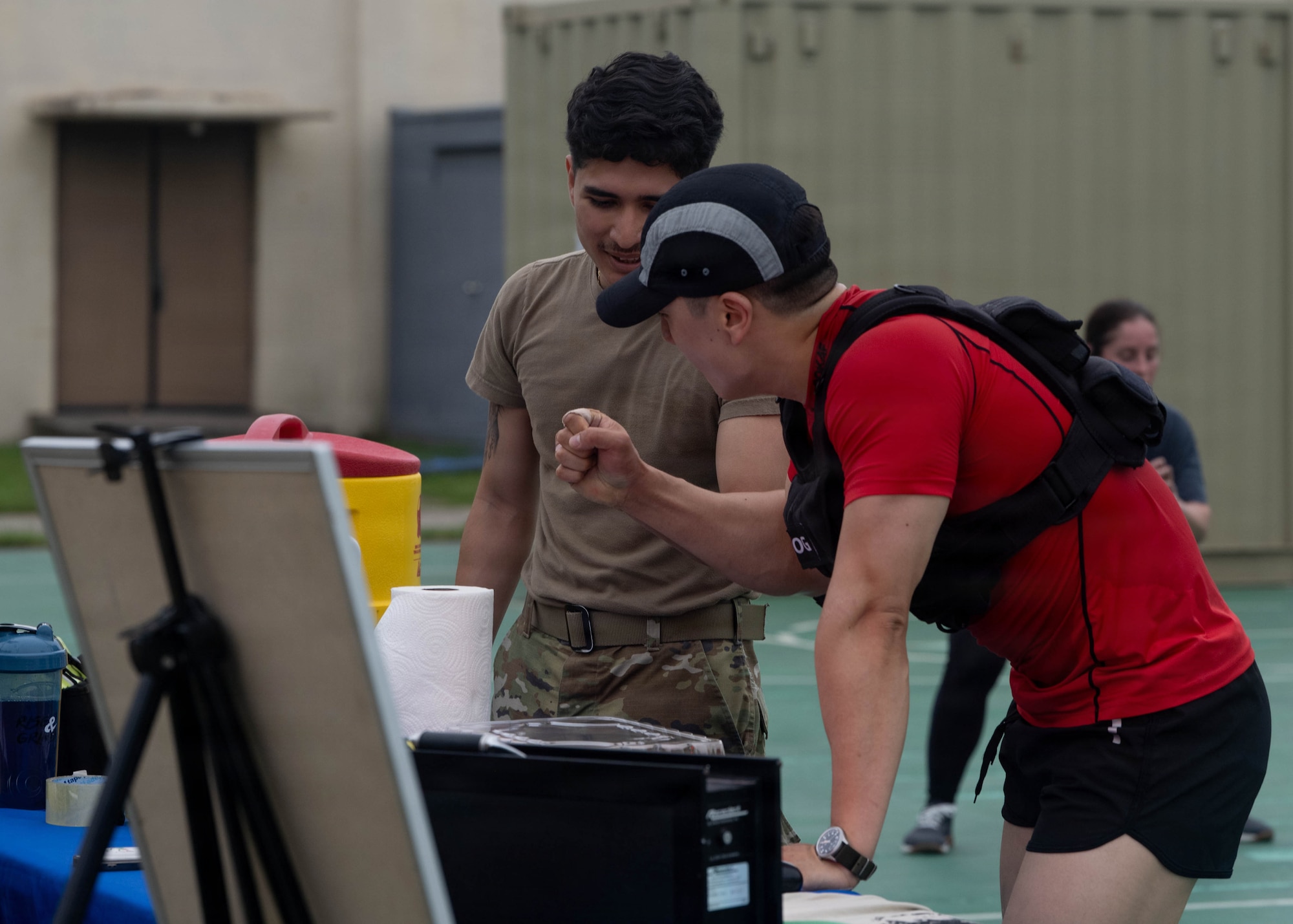 Airmen fist bump.