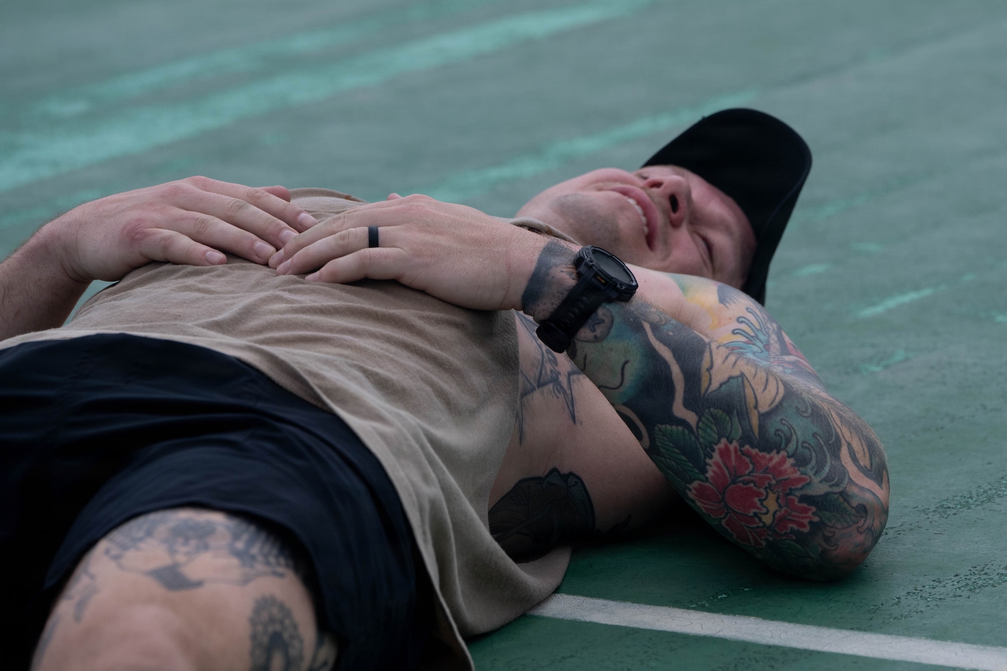Airman rests after completing the Murph Challenge.
