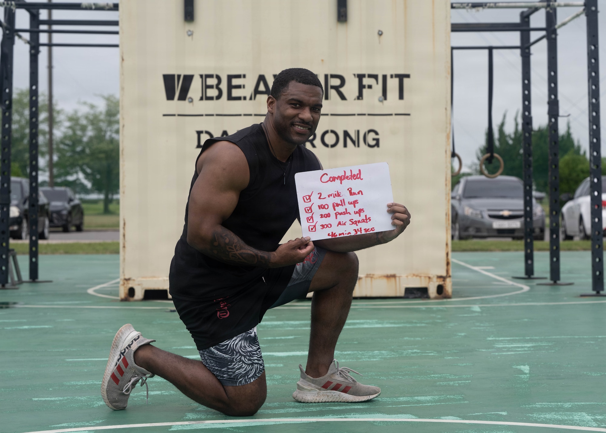 Airman holds whiteboard.