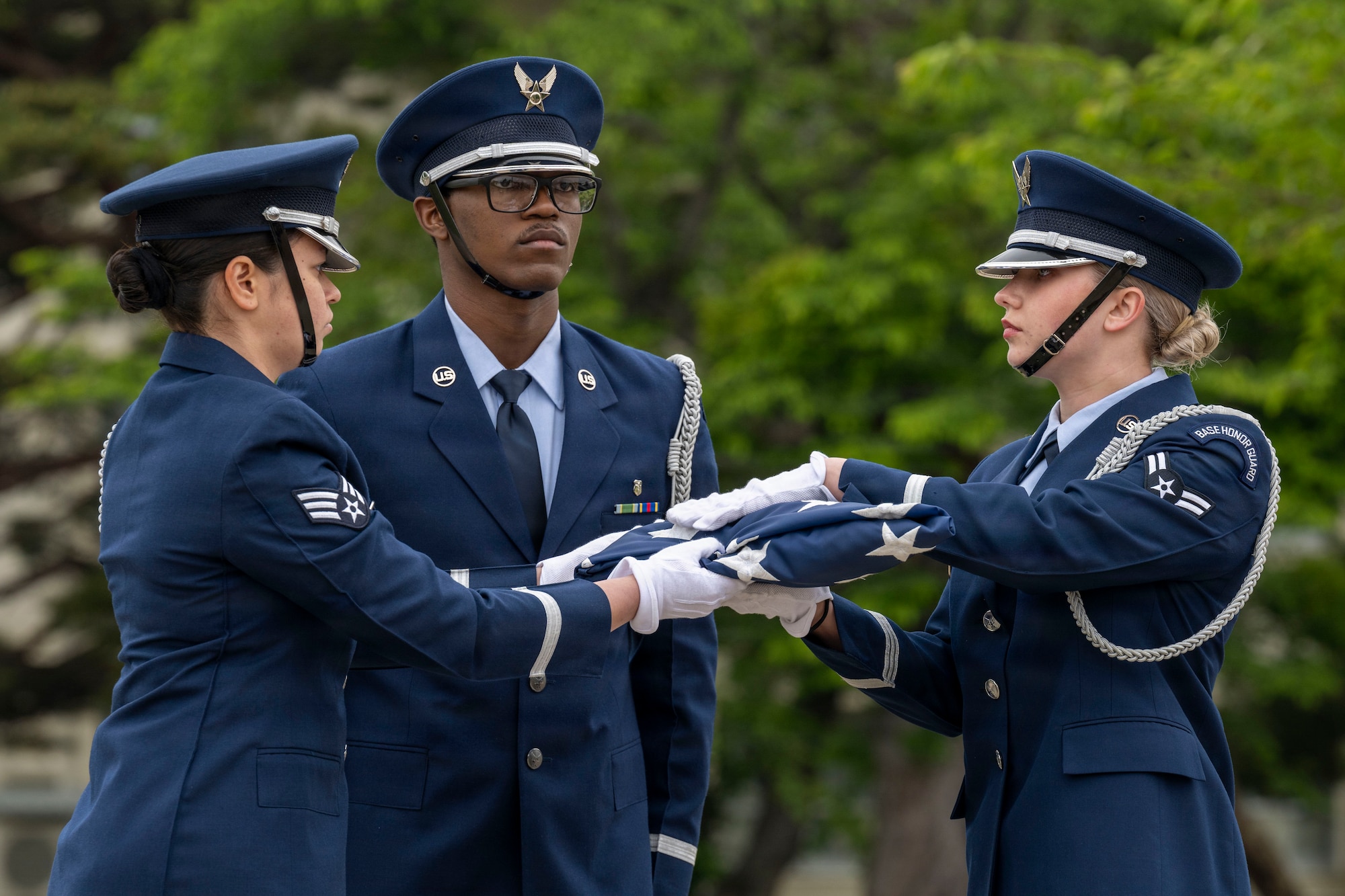 U.S. Air Force 35th Fighter Wing (FW) Honor Guard Airmen fold an American flag during a Memorial Day retreat ceremony at Misawa Air Base, Japan, May 21, 2026.