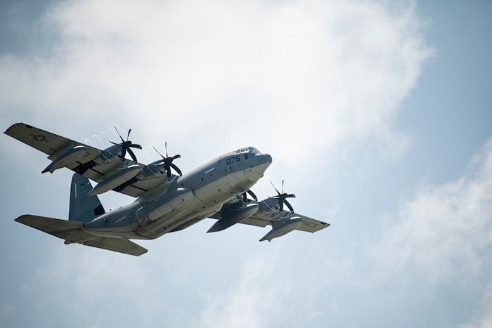 An aircraft flies through the sky