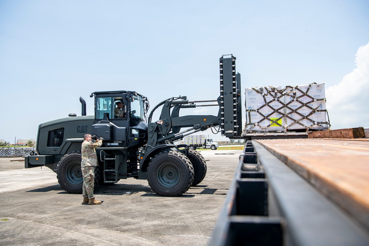 A forklift offloads supplies onto a platform