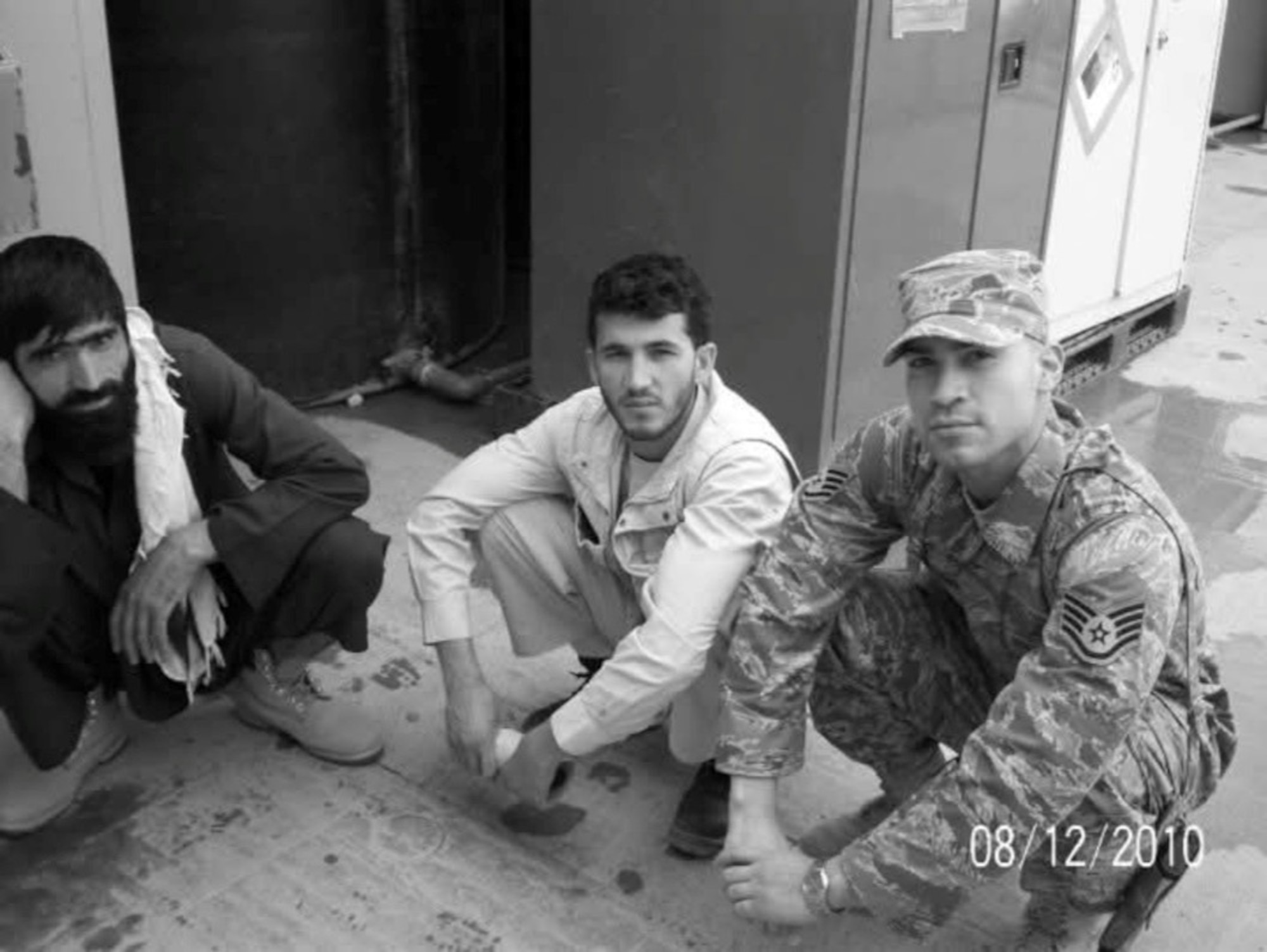 Staff Sgt. Joseph Carrilo, diet therapy specialist, right, poses for a photo with locals at Bagram Air Base, Afghanistan, Aug. 12th, 2010. Carrillo appreciated the camaraderie he formed amongst locals while deployed and credits moments like this for developing his esprit de corps. (Courtesy photo)