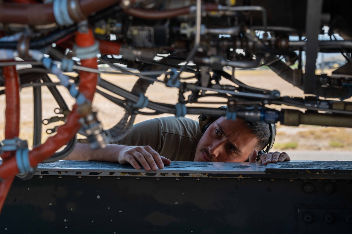 Airmen perform maintenance on a A-10 engine.