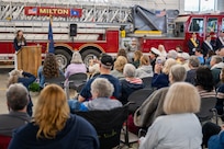 Photo of Brooke Adams, daughter of a currently deployed service member, delivering remarks during a Memorial Day ceremony in Milton, Vt., May 25, 2026.