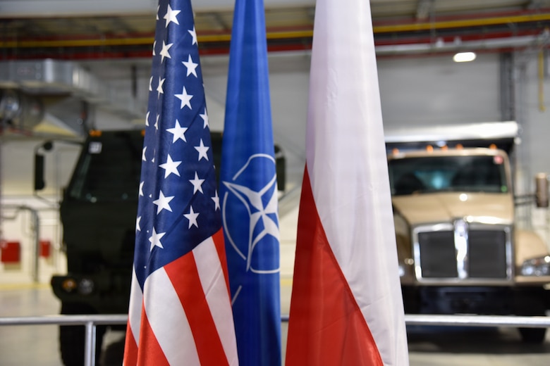 U.S. flag, NATO flag, and Poland flag