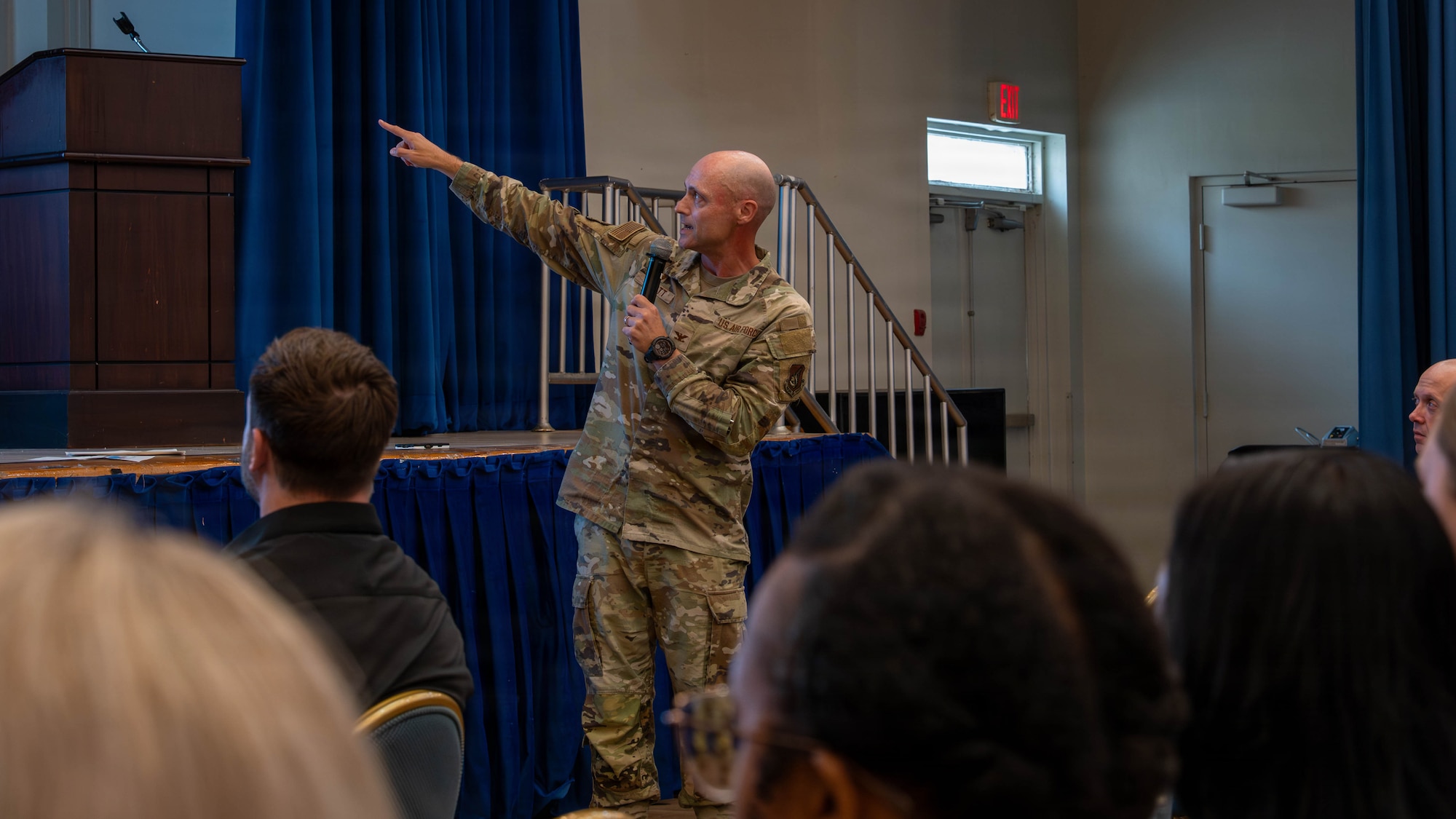 A commander speaks at a town hall.