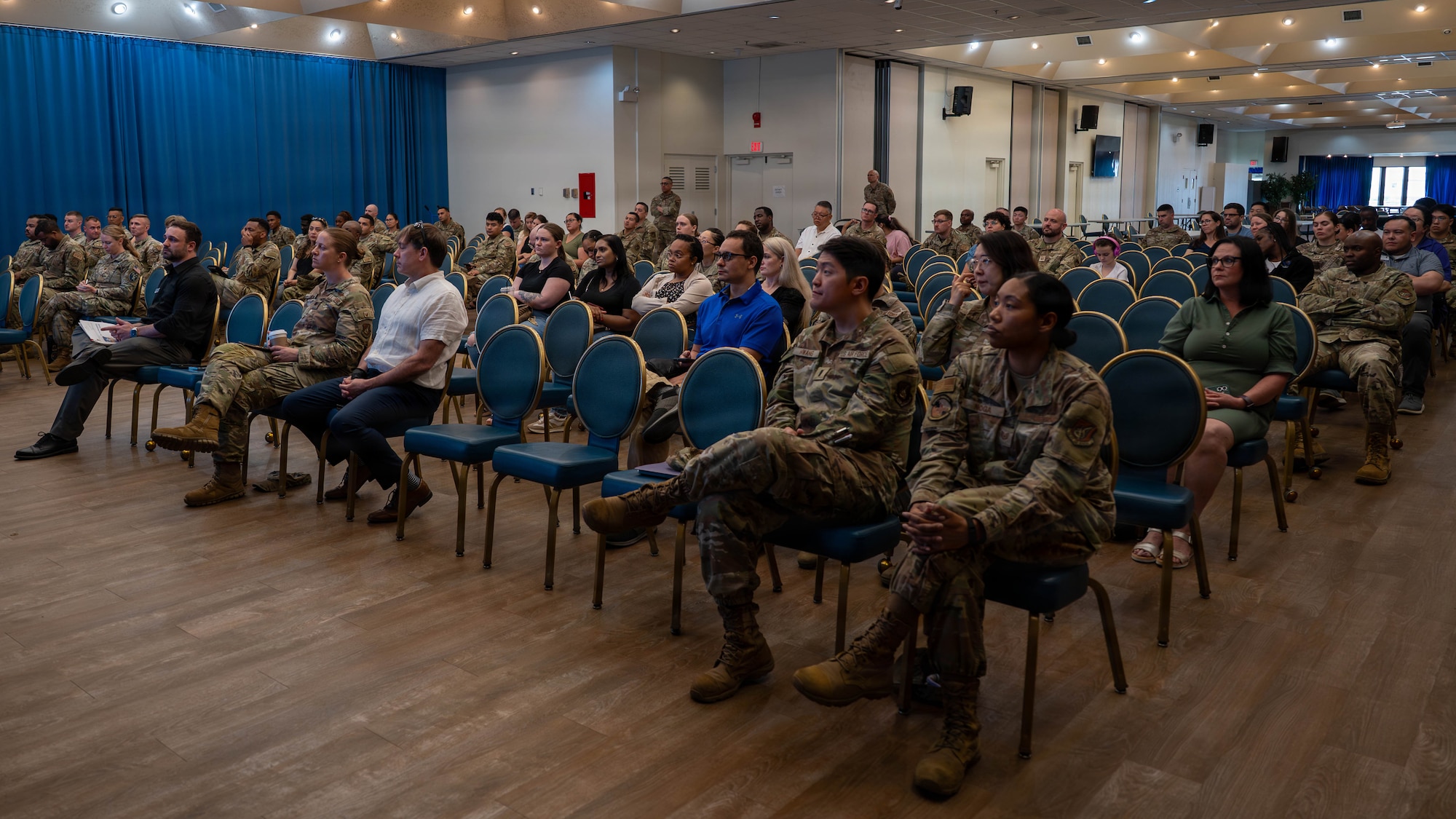Community members attend a town hall.