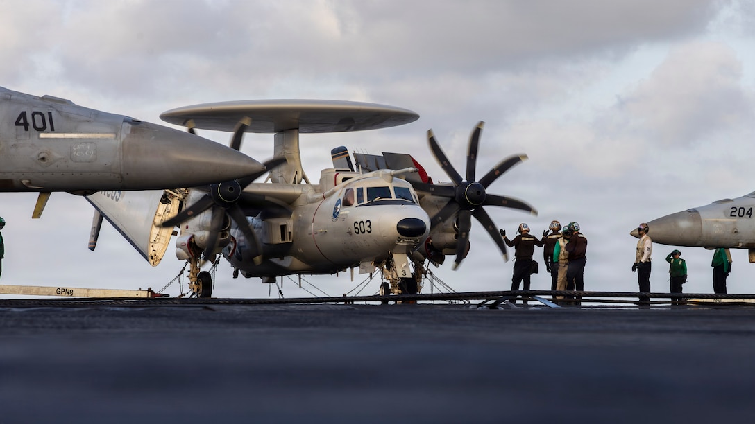 U.S. Sailors conduct maintenance on an E-2D Hawkeye, attached to Airborne Command & Control Squadron (VAW) 117, on the flight deck of Nimitz-class aircraft carrier USS Abraham Lincoln (CVN 72), May 24, 2026. Abraham Lincoln is deployed to the U.S. 5th Fleet area of operations to support maritime security and stability in the Middle East. (U.S. Navy photo)