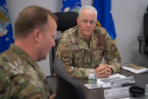 image of a man listening in a meeting.