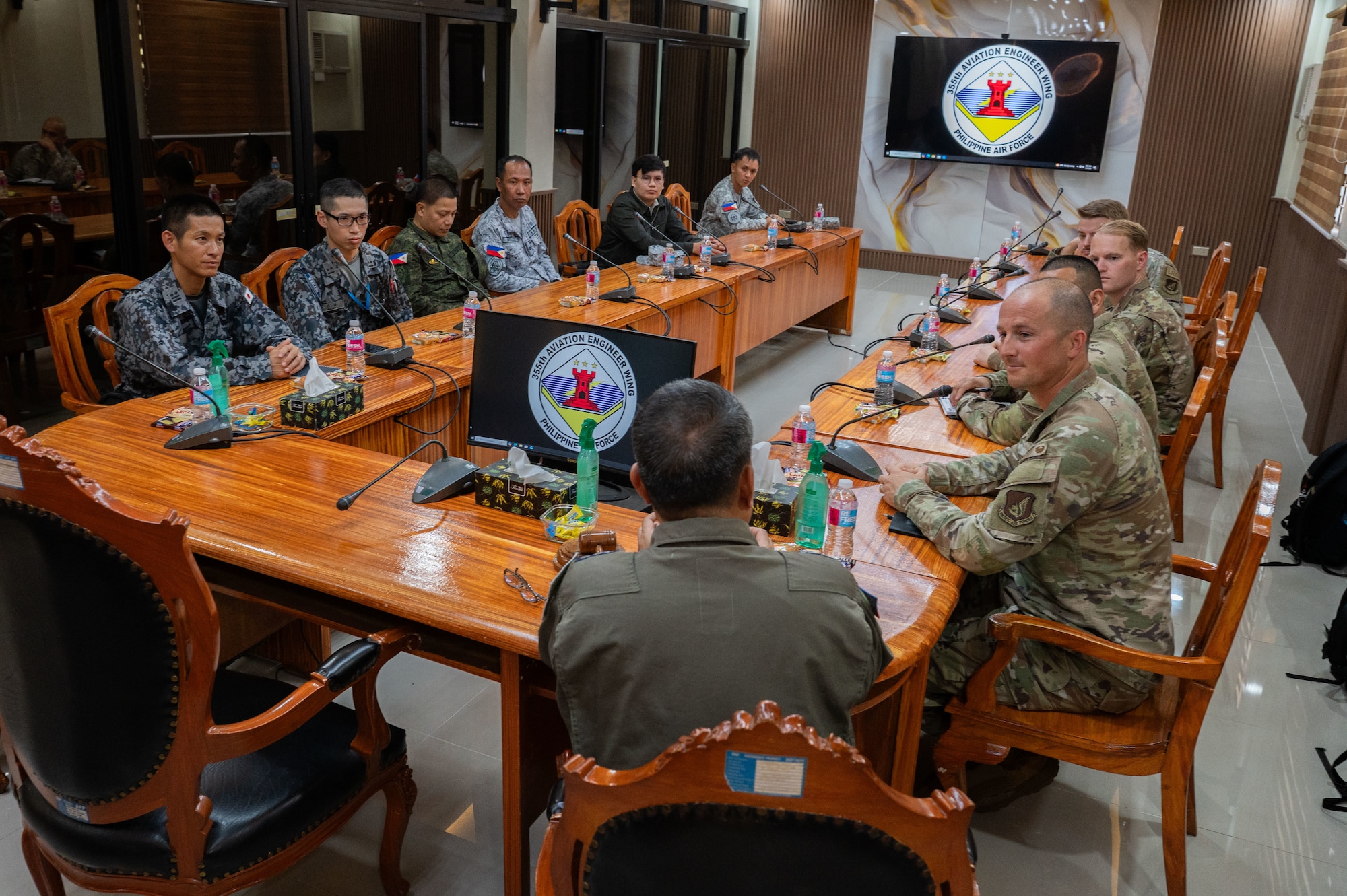 Members of the Japanese Air Self-Defense Force, left, and U.S. Airmen assigned to the 21st Air Expeditionary Wing, right, speak with Philippine Air Force Col. Reynaldo Gabinete, 355th Aviation Engineer Wing commander, during Exercise Balikatan 2026 at Basa Air Base, Philippines, May 4, 2026. Balikatan is a longstanding annual exercise between the Armed Forces of the Philippines and U.S. military designed to strengthen our ironclad alliance, improve our capable combined force and demonstrate our commitment to regional security and stability. (U.S. Air Force photo by Senior Airman Alondra Cristobal Hernandez)