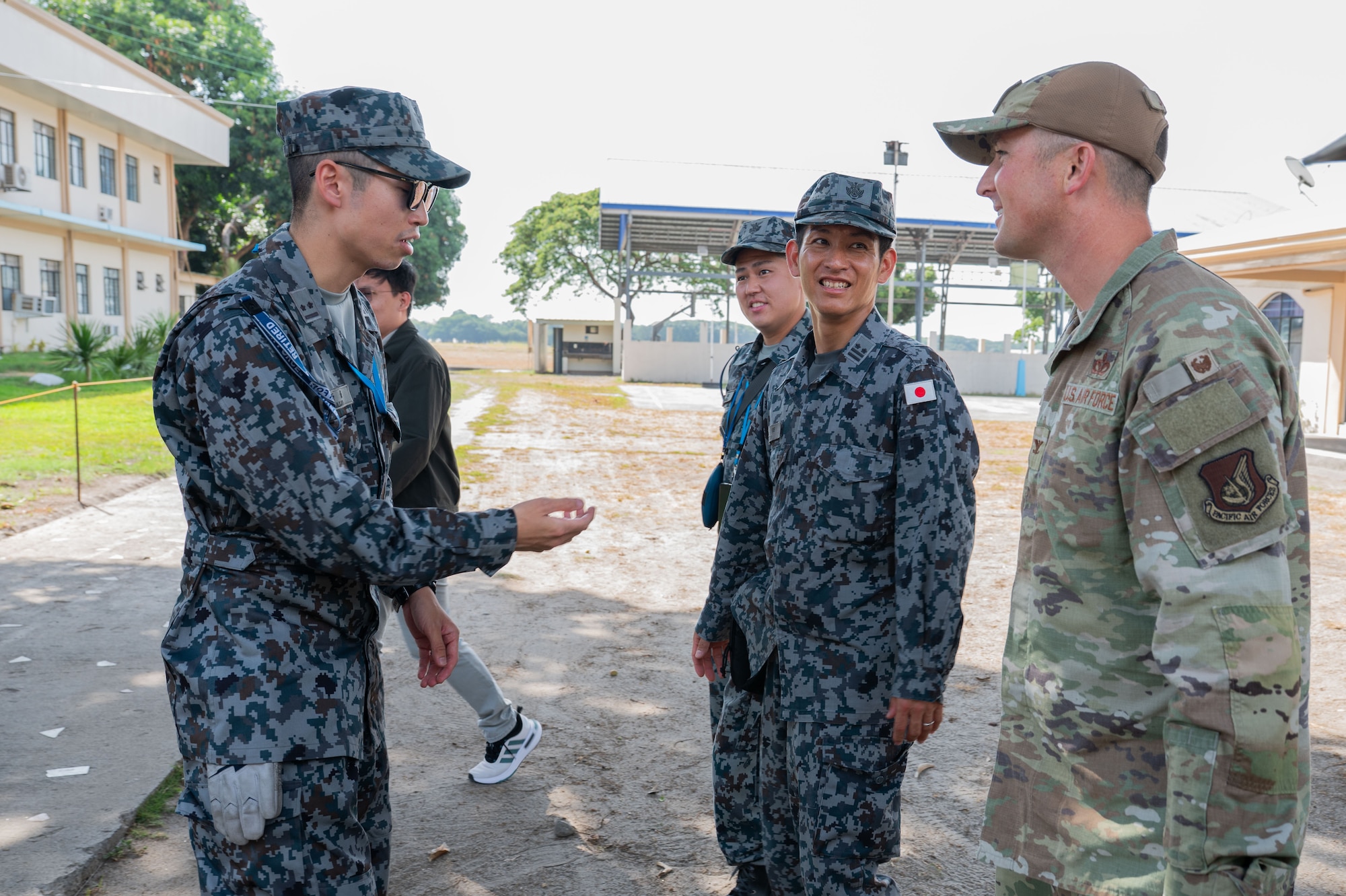 Members of the Japanese Air Self-Defense Force speak to U.S. Air Force Col. Paul Julian, 21st Air Expeditionary Wing commander, during Exercise Balikatan 2026 at Basa Air Base, Philippines, May 4, 2026. Balikatan is a longstanding annual exercise between the Armed Forces of the Philippines and U.S. military designed to strengthen our ironclad alliance, improve our capable combined force and demonstrate our commitment to regional security and stability.