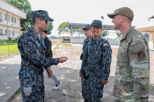 Members of the Japanese Air Self-Defense Force speak to U.S. Air Force Col. Paul Julian, 21st Air Expeditionary Wing commander, during Exercise Balikatan 2026 at Basa Air Base, Philippines, May 4, 2026. Balikatan is a longstanding annual exercise between the Armed Forces of the Philippines and U.S. military designed to strengthen our ironclad alliance, improve our capable combined force and demonstrate our commitment to regional security and stability.