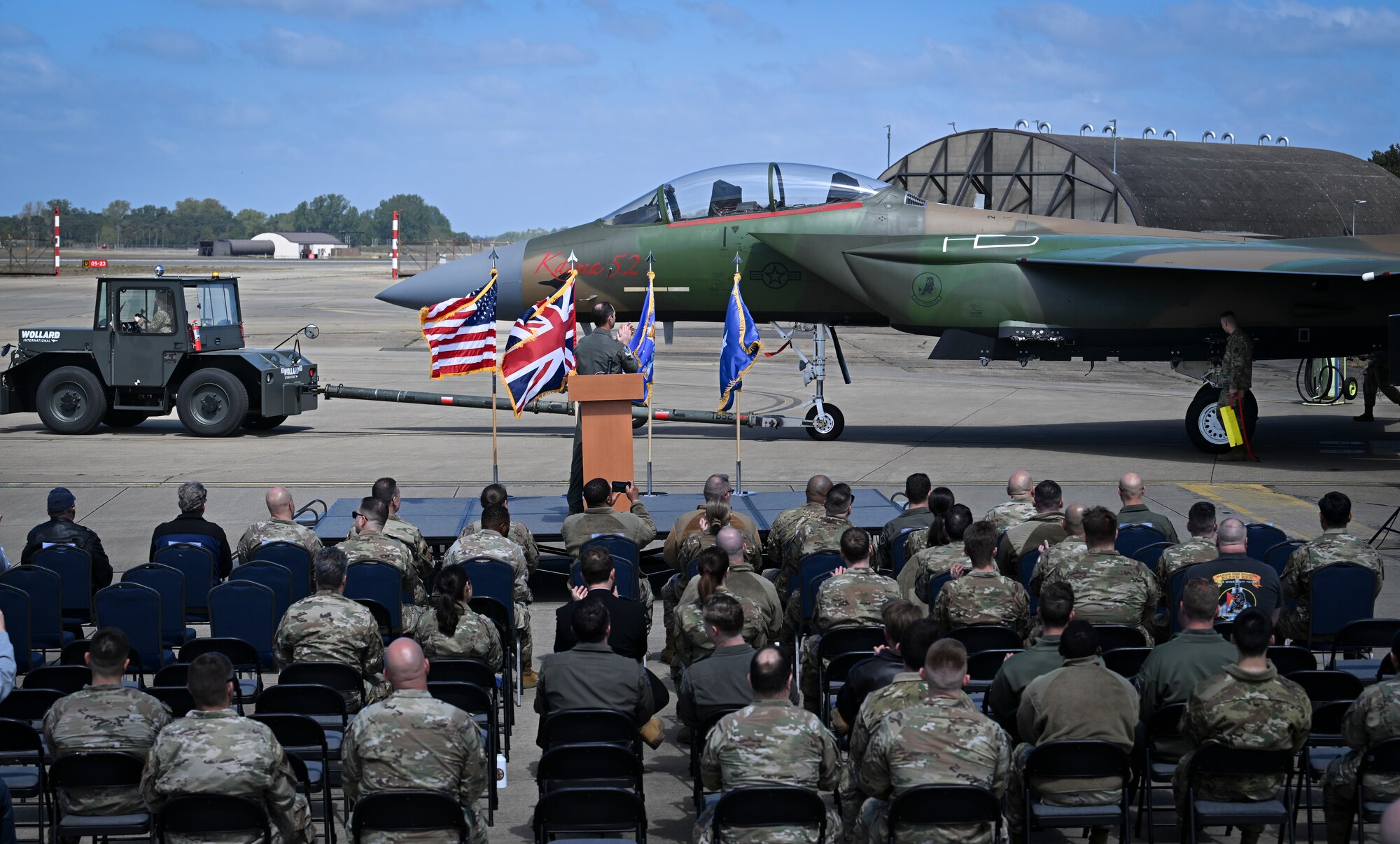 The Opeeration El Dorado 40th Anniversary paint schemed F15-E Strike eagle is rolled out in front of an appluading crowd.