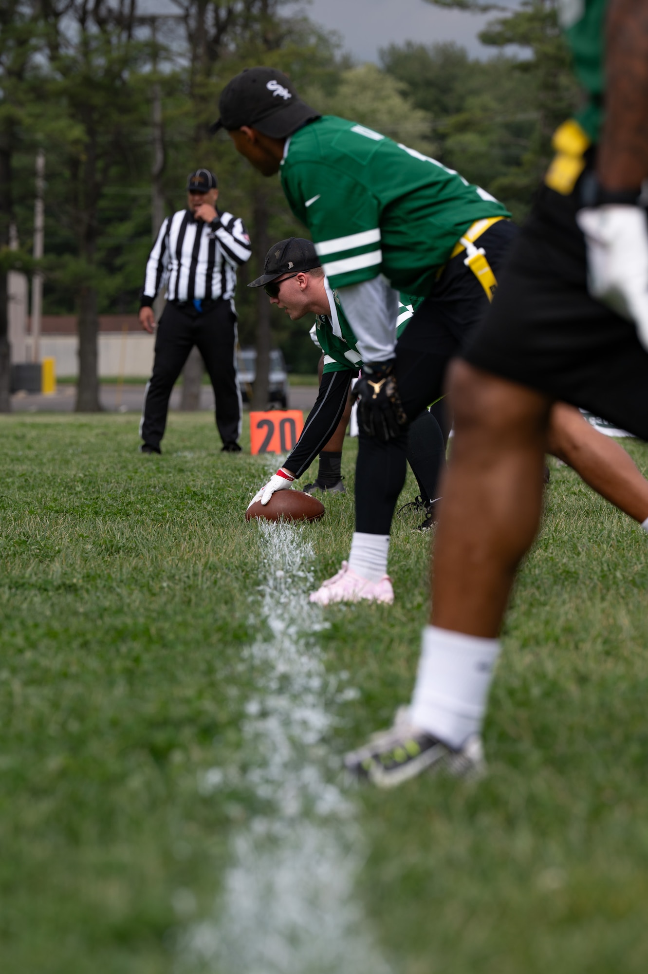 U.S. Air Force Senior Airman Seth Cox, 87th Logistics Readiness Squadron petroleum, oil and lubricant fuels service center controller, prepares to snap the football during the British army vs. Joint Base McGuire-Dix-Lakehurst flag football game at JB MDL, N.J., May 6, 2026. The game allowed JB MDL service members and British army soldiers to face off in a friendly, international showdown. (U.S. Air Force photo by Airman 1st Class Haeleigh Bayle)