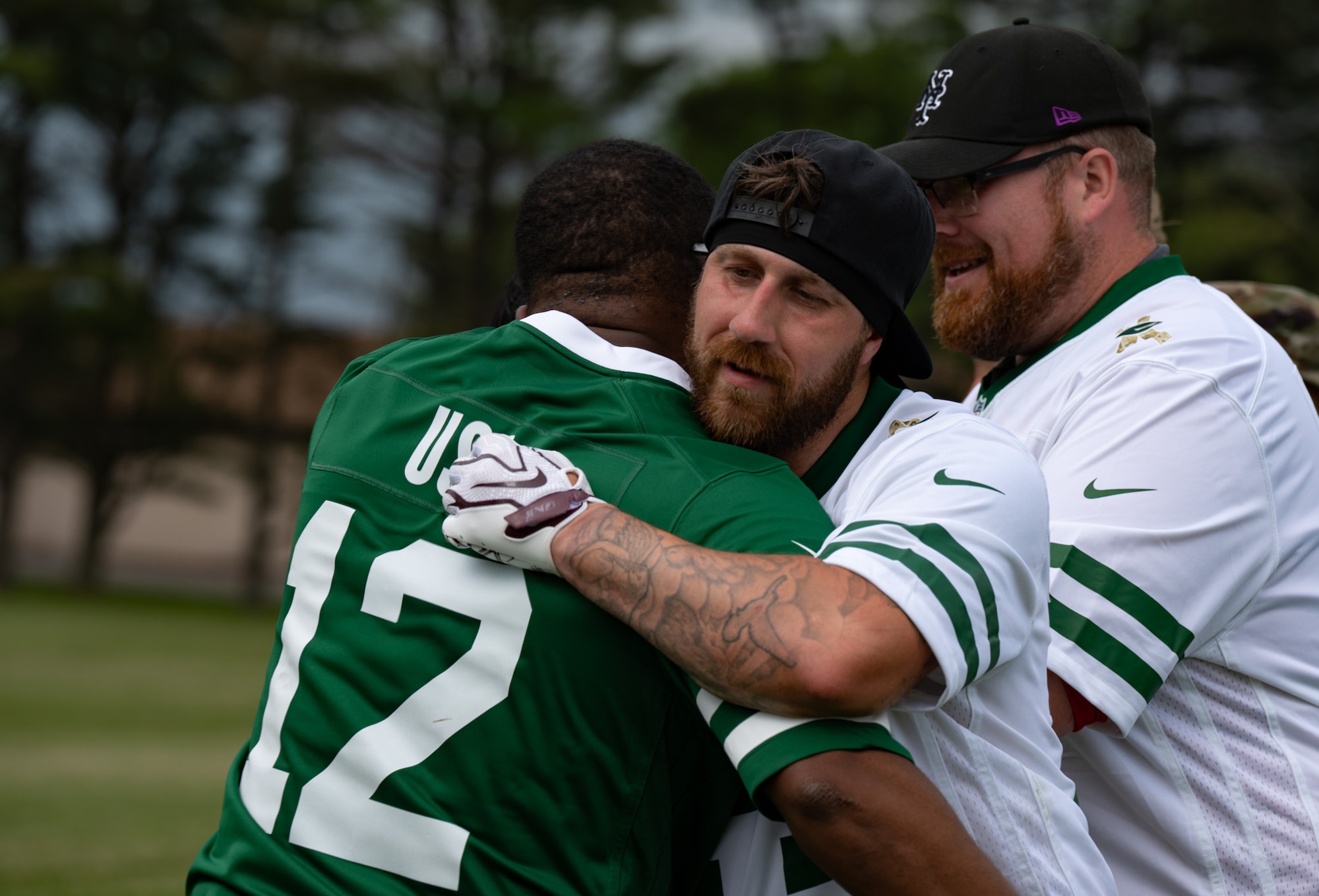 A British army soldier embraces a service member assigned to Joint Base McGuire-Dix-Lakehurst after a flag football game at JB MDL, N.J., May 6, 2026. The flag football game gave the allied forces an opportunity to meet one another and participate in an afternoon of football. (U.S. Air Force photo by Airman 1st Class Haeleigh Bayle)