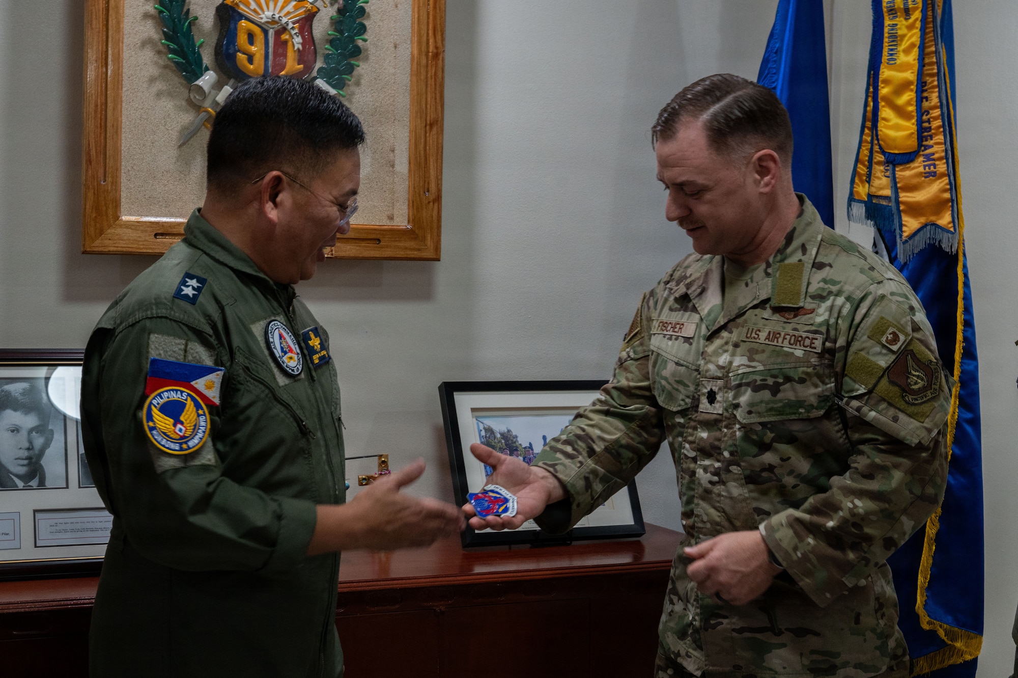 Philippine Air Force Maj. Gen. Dennis Estrella, Air Logistics Command commander, shakes hands with U.S. Air Force Lt. Col. Kevin Fischer, 21st Air Expeditionary Wing deputy commander, during a subject-matter expert exchange at Clark Air Base, Philippines, May 8, 2026. Balikatan is a longstanding annual exercise between the Armed Forces of the Philippines and U.S. military designed to strengthen our ironclad alliance, improve our capable combined force and demonstrate our commitment to regional security and stability. (U.S. Air Force photo by Senior Airman Alondra Cristobal Hernandez)