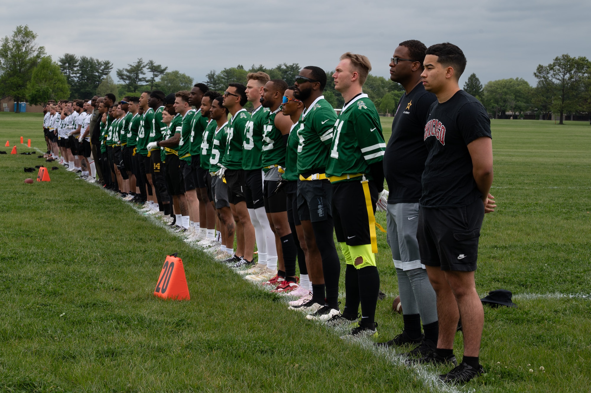 U.S. service members assigned to Joint Base McGuire-Dix-Lakehurst and British army soldiers wait for the start of the British army vs. JB MDL flag football game at JB MDL, N.J., May 6, 2026. The game allowed service members and spectators to enjoy a unique, international showdown between the allied forces. (U.S. Air Force photo by Airman 1st Class Haeleigh Bayle)