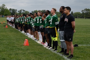 U.S. service members assigned to Joint Base McGuire-Dix-Lakehurst and British army soldiers wait for the start of the British army vs. JB MDL flag football game at JB MDL, N.J., May 6, 2026. The game allowed service members and spectators to enjoy a unique, international showdown between the allied forces. (U.S. Air Force photo by Airman 1st Class Haeleigh Bayle)