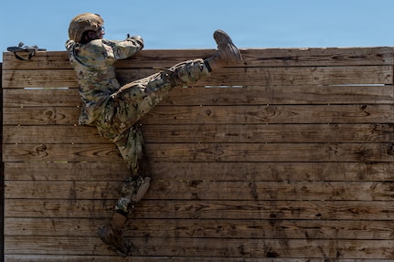 Defenders train over obstacles