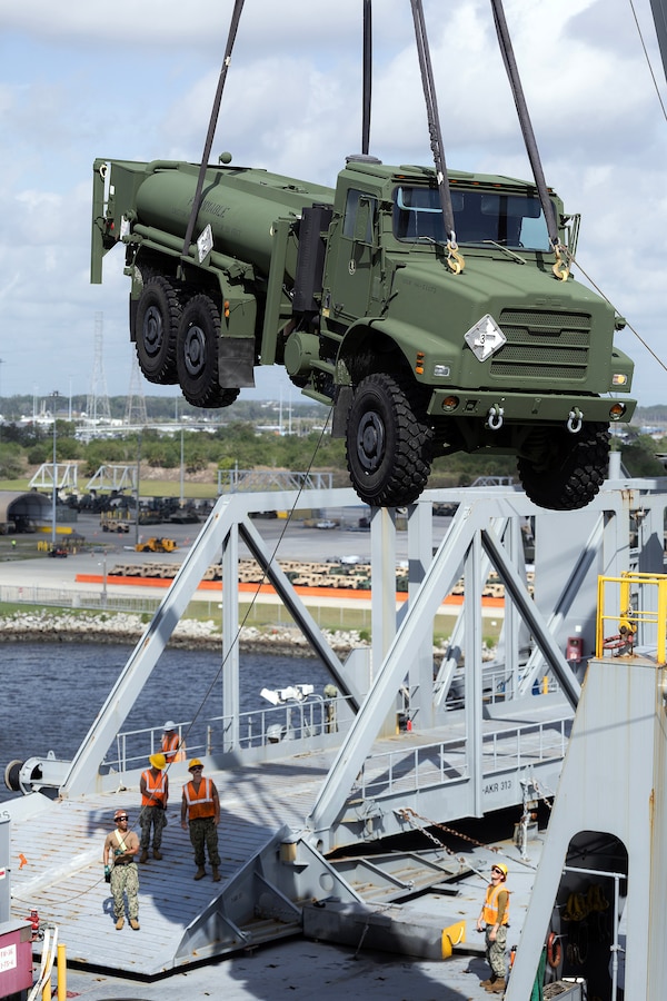 U.S. Navy Sailors assigned to 2nd Navy Expeditionary Logistics Regiment lift a tactical vehicle from an Improved Navy Lighterage System over the USNS Red Cloud on May 26, 2026, during Maritime Prepositioning Force Exercise 26 at Marine Corps Support Facility Blount Island, Florida. The exercise strengthened the Navy-Marine Corps team’s ability to move combat power from ship to shore using Navy lighterage, specialized maritime infrastructure and a veteran workforce supporting expeditionary sustainment operations. (Official Marine Corps photo by Dustin Senger)