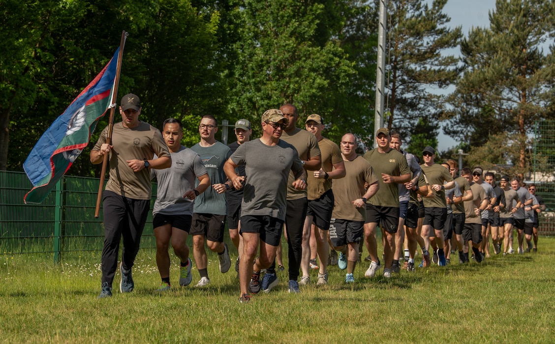 U.S. service members stand at attention