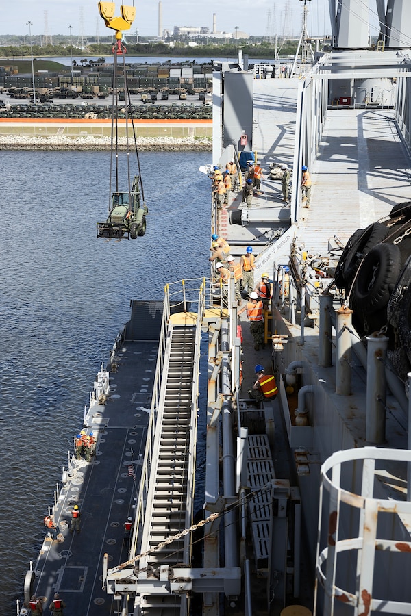 U.S. Navy Sailors assigned to 2nd Navy Expeditionary Logistics Regiment lift a tactical vehicle from an Improved Navy Lighterage System over the USNS Red Cloud on May 26, 2026, during Maritime Prepositioning Force Exercise 26 at Marine Corps Support Facility Blount Island, Florida. The exercise strengthened the Navy-Marine Corps team’s ability to move combat power from ship to shore using Navy lighterage, specialized maritime infrastructure and a veteran workforce supporting expeditionary sustainment operations. (Official Marine Corps photo by Dustin Senger)