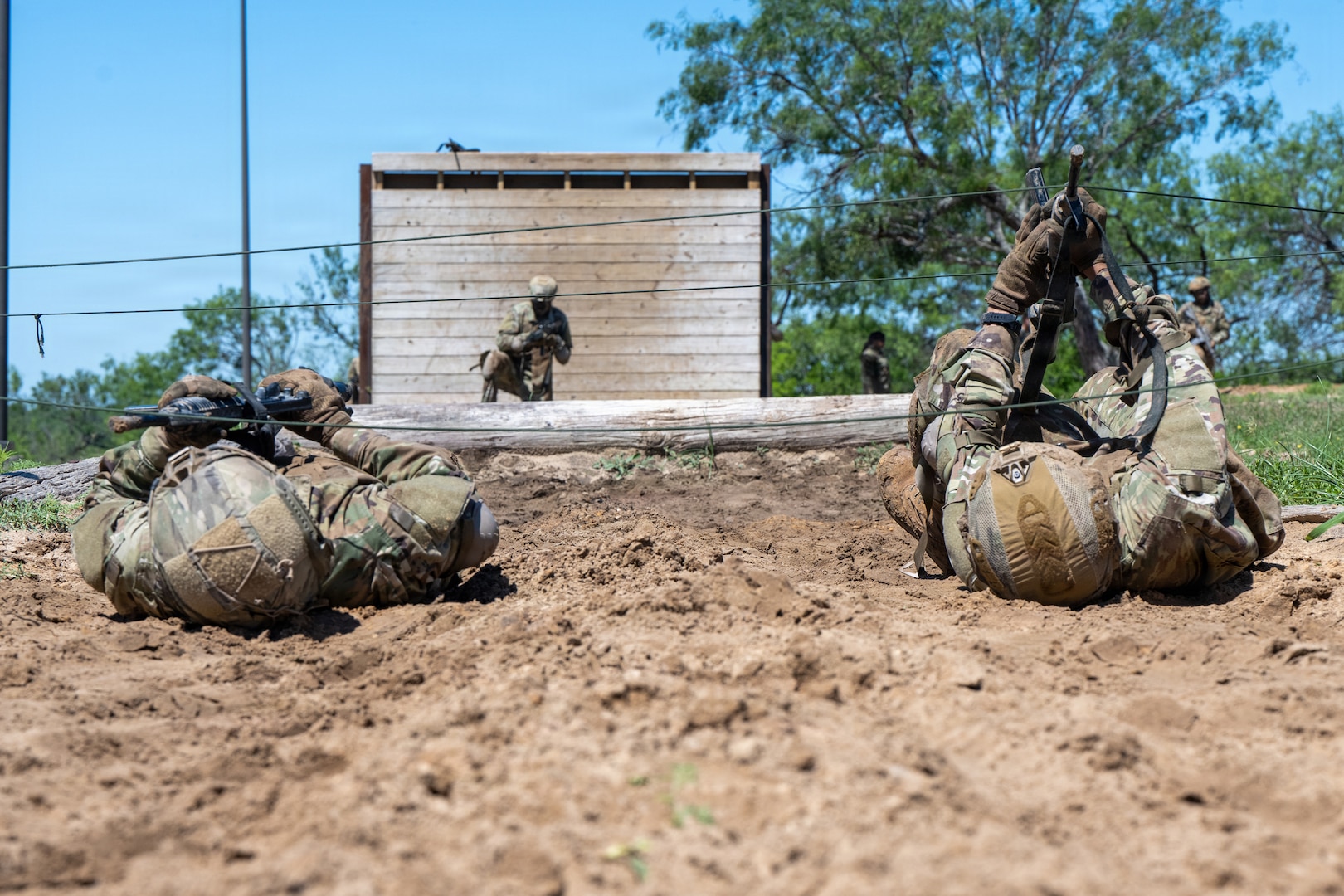 Defenders train over obstacles