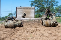 Defenders train over obstacles