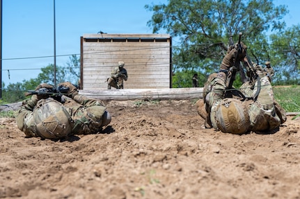 Defenders train over obstacles