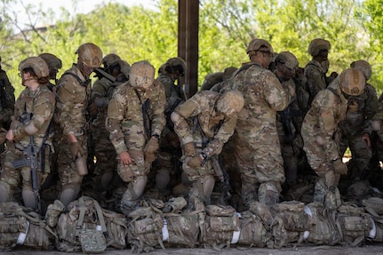 Defenders train over obstacles