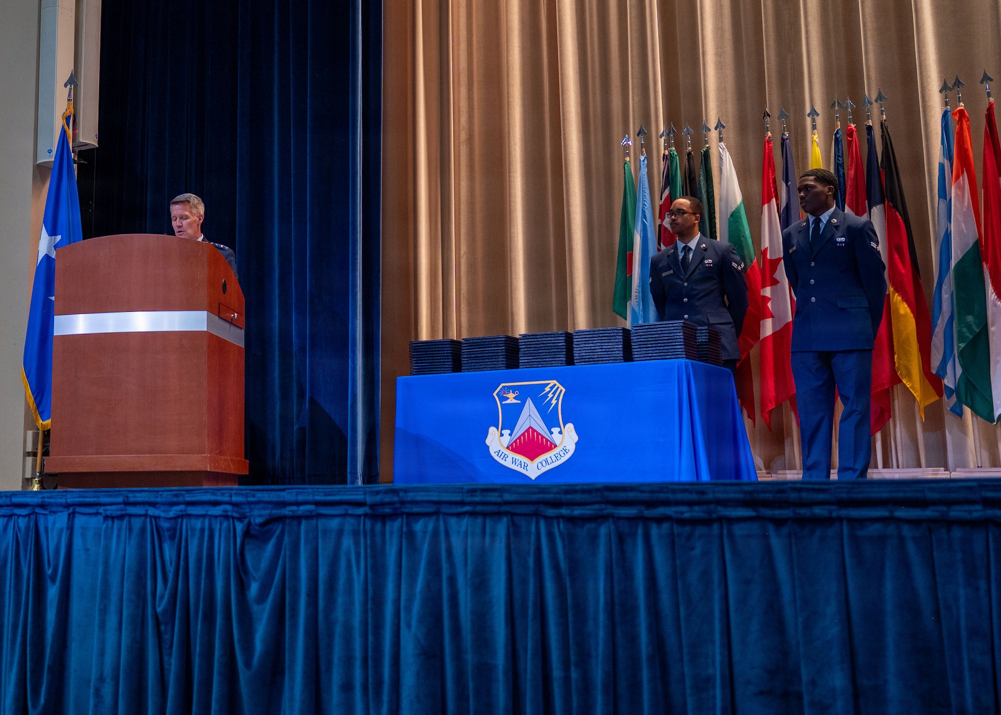 Students from Air War College present a memento from the academic class of 2026 to Brig. Gen. Jocelyn Schermerhorn, AWC commander, during the graduation ceremony for Air War College at Maxwell Air Force Base, Alabama, May 14, 2026. The graduating class consisted of officers from all military branches of the U.S. military, civilian employees of federal government agencies, and officers from international allies and partner nations. (U.S. Air Force photos by Senior Airman Tanner Doerr)