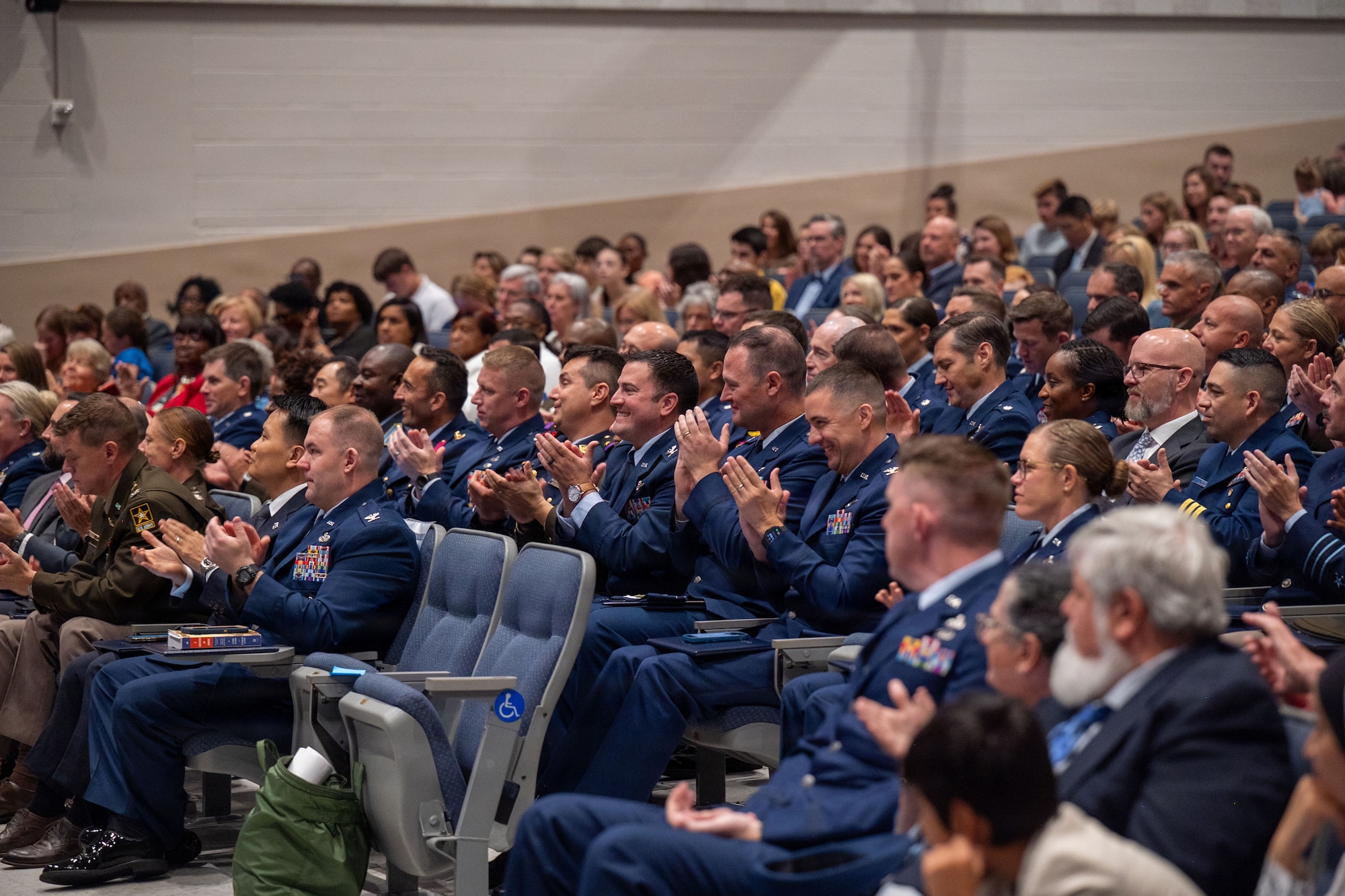 Students from Air War College present a memento from the academic class of 2026 to Brig. Gen. Jocelyn Schermerhorn, AWC commander, during the graduation ceremony for Air War College at Maxwell Air Force Base, Alabama, May 14, 2026. The graduating class consisted of officers from all military branches of the U.S. military, civilian employees of federal government agencies, and officers from international allies and partner nations. (U.S. Air Force photos by Senior Airman Tanner Doerr)