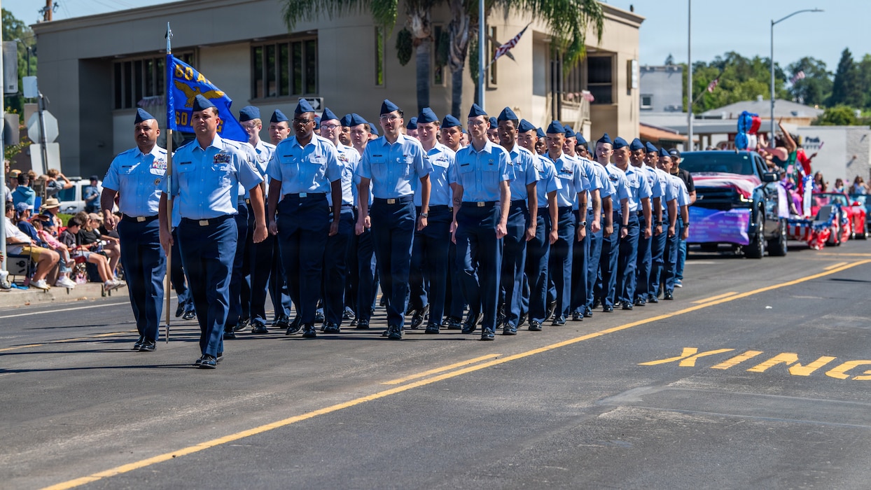 Airmen march in formation in parade