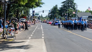 Airmen march in formation in parade
