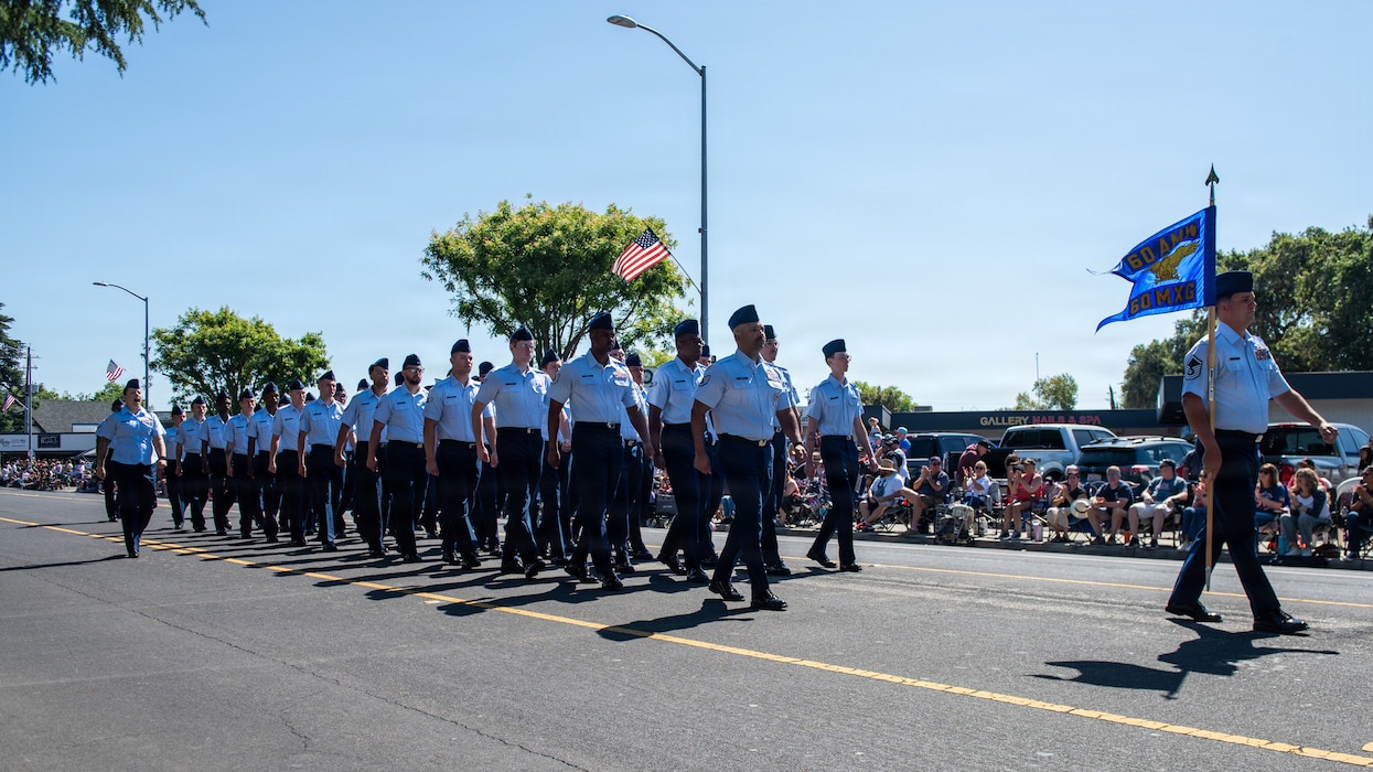 Airmen march in formation in parade